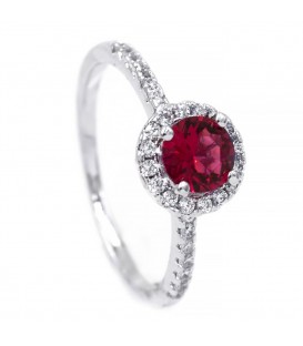 Кільце - родіум Круглий камінь 0,6 у 4х тримачах в оправі дрібного каміння, дрібне каміння на всі боки